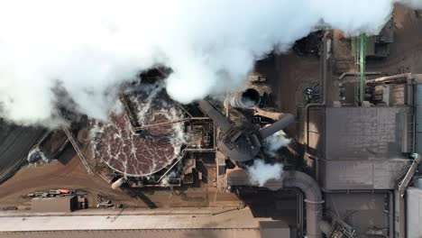 Top-down-aerial-of-steam-and-smog-coming-from-US-Steel-Edgar-Thomson-Plant-in-Braddock,-PA