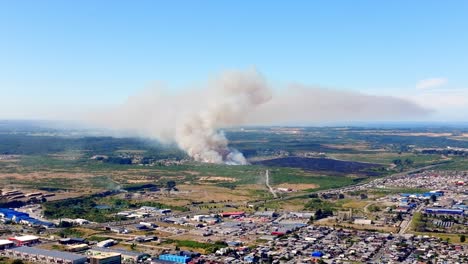 Aerial-View-Of-Distant-Forest-Fires-In-Chilean-City-Of-Puerto-Montt-With-Large-Plumes-Of-Smoke-Rising-In-The-Air