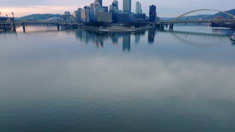 Aerial-tilt-up-reveal-of-Point-State-Park-and-the-converge-of-the-Allegheny-and-Monongahela-Rivers-into-the-Ohio