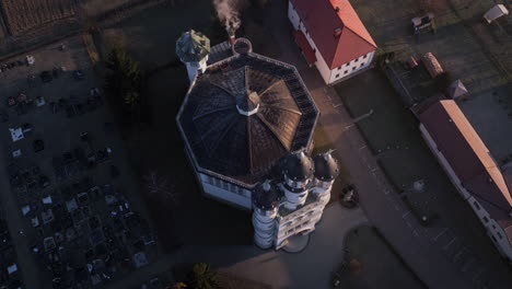 Drone-shot-of-a-church-in-the-early-morning-in-a-small-village