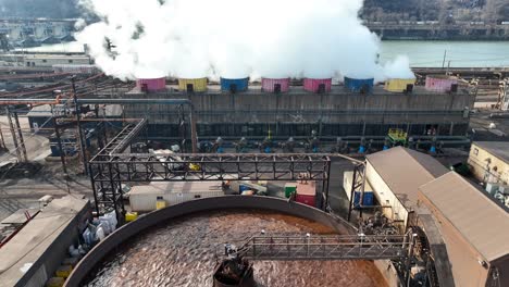 Aerial-tilt-up-reveal-from-water-treatment-at-US-Steel-plant-in-Braddock-Pennsylvania