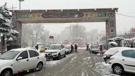 Best-beautiful-scenic-snow-snowfall-cityscape-view-in-winter-season-landscape-in-Tehran-Holy-place-mosque-shrine-imam-Zadeh-Saleh-minaret-Tajrish-people-walking-to-traditional-local-mall-bazaar-shop