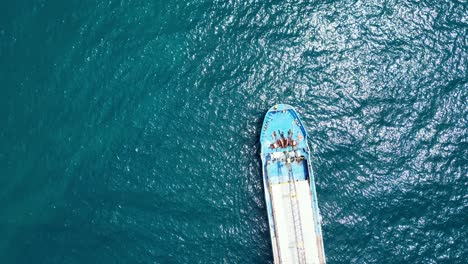 Aerial-Top-View-of-Large-Ship-Drifting-in-Blue-Ocean-in-Virac,-Catanduanes,-Philippines-Asia