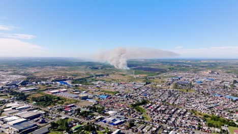 Aerial-View-Of-Distant-Forest-Fires-In-Chilean-City-Of-Puerto-Montt-With-Large-Plumes-Of-Smoke-Rising-In-The-Air