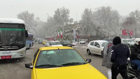 Public-transportation-in-Iran-Tehran-in-a-cold-frozen-morning-Day-in-Tajrish-Square-in-Tehran-Iran-gran-traditional-old-local-market-bazaar-to-buy-grocery-people-walking-taste-street-food-snowfall