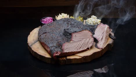 Smoky-hot-grilled-pork-ham-on-a-rustic-wooden-plate-with-pickles-medium-shot