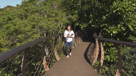 Tourist-woman-enters-Kirstenbosch-Tree-Canopy-Walkway-in-Cape-Town-RSA