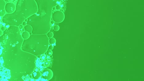 Microscopic-particles-float-in-a-green-substance-with-oils-and-hazardous-substances