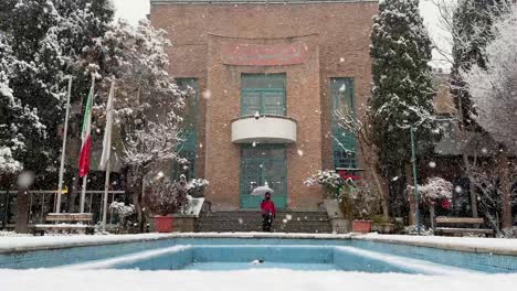 Persian-Garden-Blue-Howz-pool-Traditional-Architecture-design-and-old-local-brick-material-construction-building-in-Tehran-Honarmandan-Park-offers-a-scenic-cinematic-wide-view-landscape-of-a-city-life
