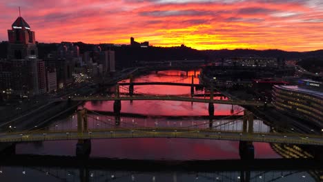 Three-yellow-bridges-in-Pittsburgh,-Pennsylvania-at-sunset