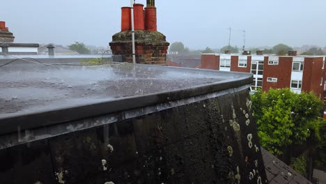 Heavy-rain-downpour-on-a-flat-residential-roof