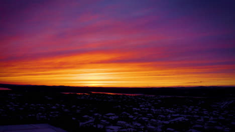 Aerial-view-of-a-vibrant,-colorful-winter-sunset