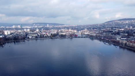 Zurich-old-town-aerial-view-over-Limmat-river-urban-downtown-waterfront-skyline,-Switzerland