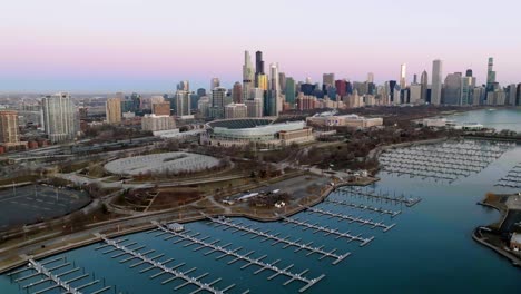 Establishing-drone-shot-of-the-Solider-field-stadium,-vibrant-evening-in-Chicago,-USA
