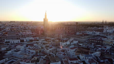Cinematic-bright-sunset-behind-Seville-Cathedral,-Spain