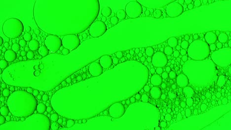 Abstrakte-Öltropfen-Hintergrund-In-Grüner-Flüssigkeit-Für-Kosmetische-Behandlungen-Hydroge