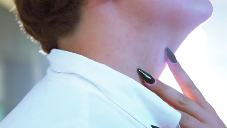 Close-up-of-LGBTQ-man-caressing-the-neck-in-slow-motion-with-long-painted-fingernails