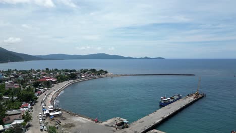 High-Aerial-Drone-View-of-Idyllic-Waterfront-Town-and-Port-in-Virac,-Catanduanes,-Philippines