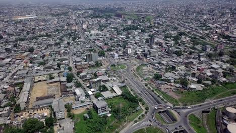 Aerial-view-overlooking-the-cityscape-of-Douala-city,-sunny-day-in-Cameroon,-Africa