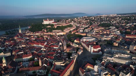 Aerial-View-of-Bratislava-Castle-and-Old-Town-at-Sunset,-Drone-Aerial-View