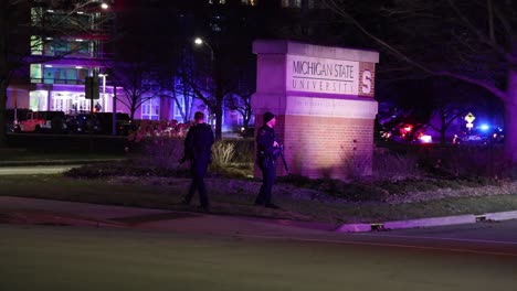 Michigan-State-University-Mass-Shooting-Police-at-MSU-Sign-with-guns