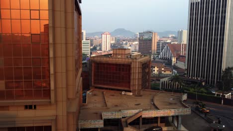 Aerial-view-in-middle-of-high-rise,-in-downtown-Yaounde,-sunny-evening-in-Cameroon