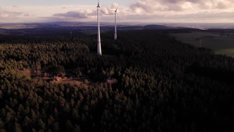 Opening-scene-of-two-wind-turbines-at-a-beautiful-sunset