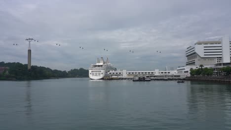 Views-of-the-Resort-World-Cruise-docking-at-the-Singapore-Cruise-Centre-and-moving-cable-cars-near-Sentosa-Island