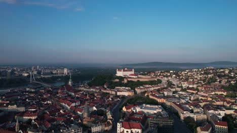 From-the-stunning-hilltop-views-of-Bratislava-castle-to-the-bustling-streets-of-the-city-below,-aerial-footage-captures-the-essence-of-Slovakia's-capital-and-its-unique-charm