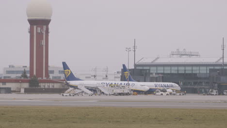 Ryanair-Airplane-Pushed-By-Pushback-Tug-At-The-Gdansk-Lech-Wałesa-Airport-In-Gdansk,-Poland