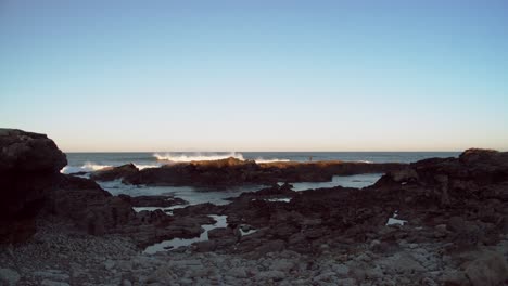 Ocean-eroded-reefs-of-Cascais-in-Portugal,-wide-angle-stable-view,-copyspace