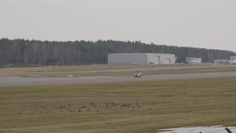 Technical-car-performs-runway-inspection-before-aircraft-landing
