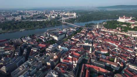Take-a-journey-through-time-with-aerial-views-of-Bratislava-city-and-castle,-showcasing-the-evolution-of-Slovakia's-capital-from-medieval-times-to-the-present-day