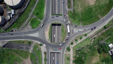 Aerial-view-above-a-roundabout-overpass-in-Douala,-Cameroon,-Africa---top-down,-drone-shot