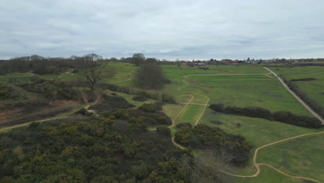 360-aerial-view-of-Hadleigh-Park-mountain-bike-trails-in-Essex,-drone
