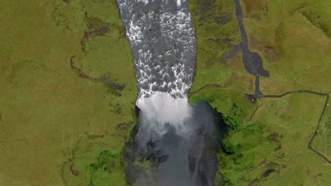 Aerial:-Top-down-shot-of-Skogafoss-waterfall-in-Iceland