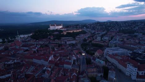 Amazing-sunset-aerial-view,Explore-the-hidden-gems-of-Bratislava-city-and-castle,-with-aerial-footage-offering-a-new-perspective-on-the-city's-lesser-known-landmarks-and-hidden-treasures