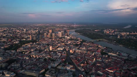 Aerial-establishing-shot-of-downtown-Bratislava-during-sunset