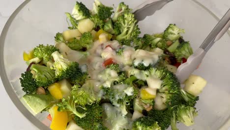 Broccoli-Salad-Mixed-With-Chopped-Vegetables,-Fruits,-And-Nuts
