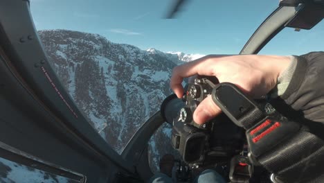 POV-of-a-photographer-in-the-cockpit-of-a-helicopter-ride-in-the-mountains-of-Canada,-BC