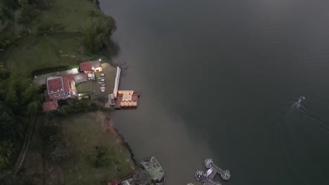 Aerial-view-from-a-drone-of-La-Piedra-del-Penol-and-the-Guatape-reservoir-near-Medellin,-Antioquia,-Colombia,-Guatapé-landscape