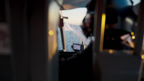 Back-seat-view-of-a-pilot-flying-a-helicopter-through-the-cold-winter-mountain-sides-of-Canada,-BC