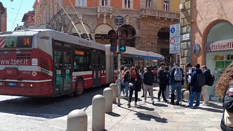 Iveco-Crealis-Neo-articulated-bus-of-Tper-public-transportation-company-in-the-streets-of-Bologna,-Italy