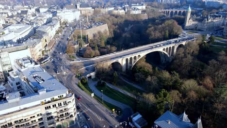 Reveal-drone-shot-over-Luxembourg-city-center-bridge-golden-lady