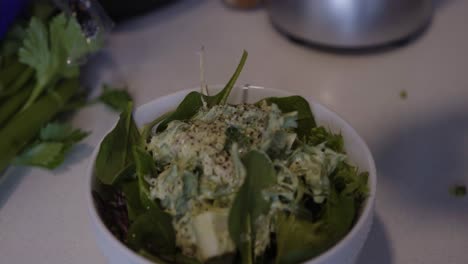 Finishing-a-vegan-tuna-salad-bowl-with-freshly-squeezed-lemon