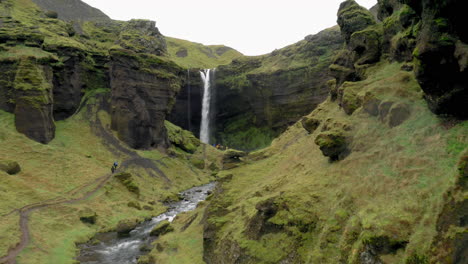 Aerial:-Fly-through-narrow-canyon-towards-Kvernufoss-waterfall-in-Iceland