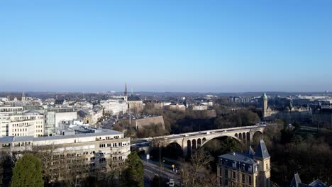 ascending-drone-shot-over-Luxembourg-city-center-bridge-golden-lady