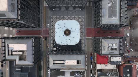 Top-down-aerial-shot-of-ice-skaters-in-urban-city-square