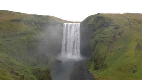 Flying-away-from-Skogafoss-waterfall-in-Iceland-on-an-overcast-day