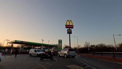 13-February-2023---Evening-Sunset-View-Looking-At-MacDonald's-Drive-Tru-Sign-At-Northolt-Target-Roundabout-With-Petrol-Station-In-Background